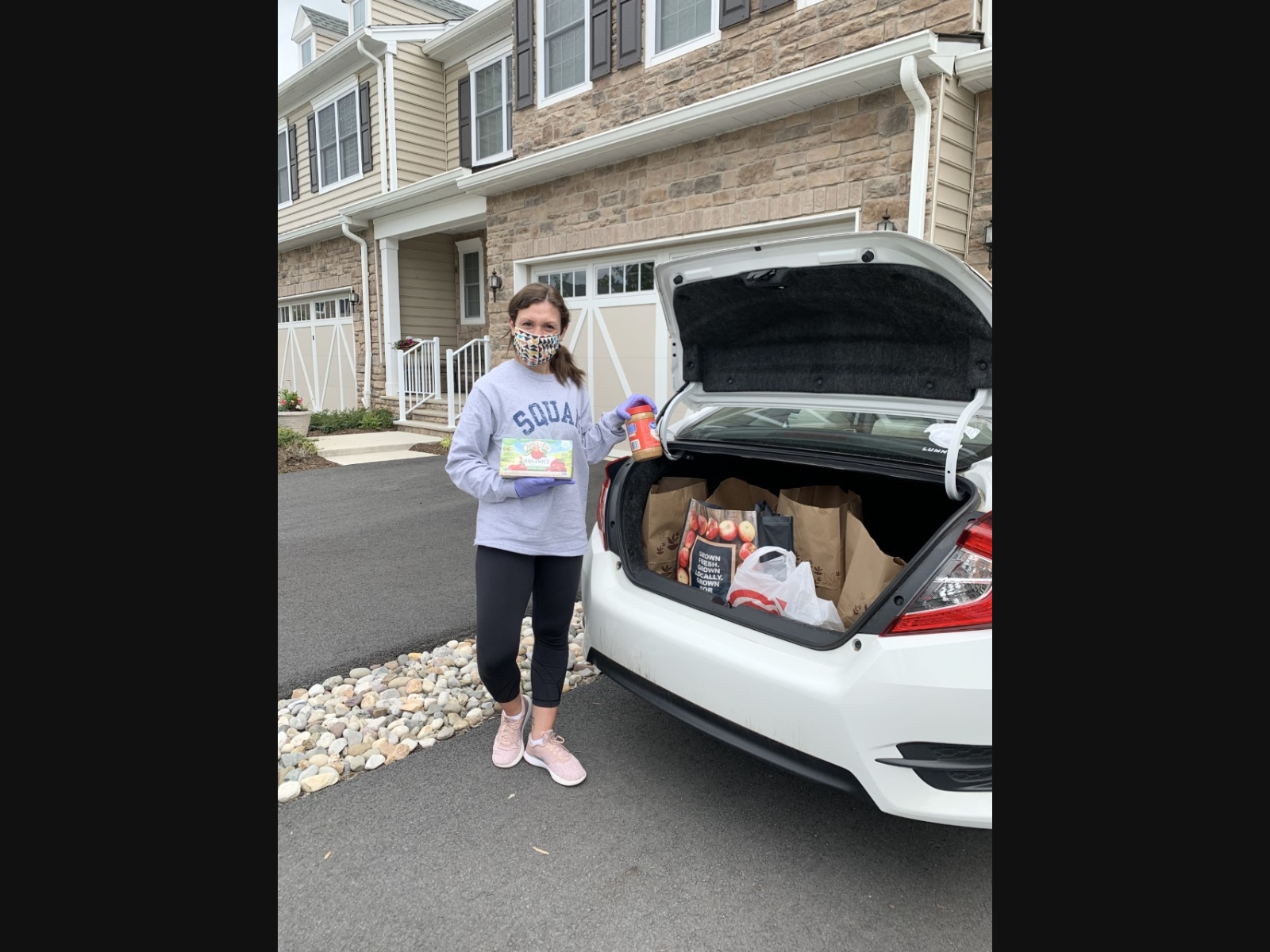 Pictured is Madison Area YMCA Associate Development Director Melissa DeSalvo from Morristown preparing to drop-off non-perishable items for the Y’s Food Drive. 