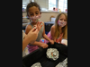 (L to R) Madison Area YMCA MiniQuest campers Vera Ponce Ratner, age 6 from Madison and Annabelle Hanley Branson, age 5 from Florham Park test just how many pennies and marbles their aluminum foil boats can hold.