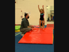 Gwen Stein age 4 from Chatham practices her forward roll in her Gymnastics Pod class with the help of Preschool Gymnastics & Y Ninja Gym Associate Gus Ibranyi. 