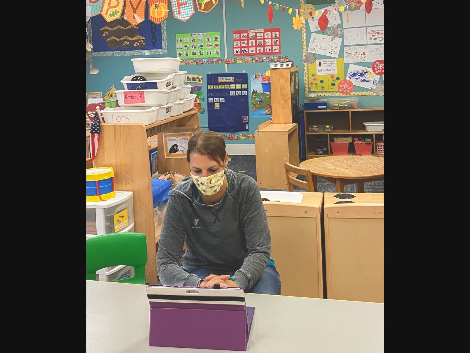 Pictured is Preschool Terrific Tigers Lead Teacher Rebecca Natafalusy, preparing for her classroom’s virtual Back to School Night at the F.M. Kirby Children’s Center of the Madison Area YMCA. 
