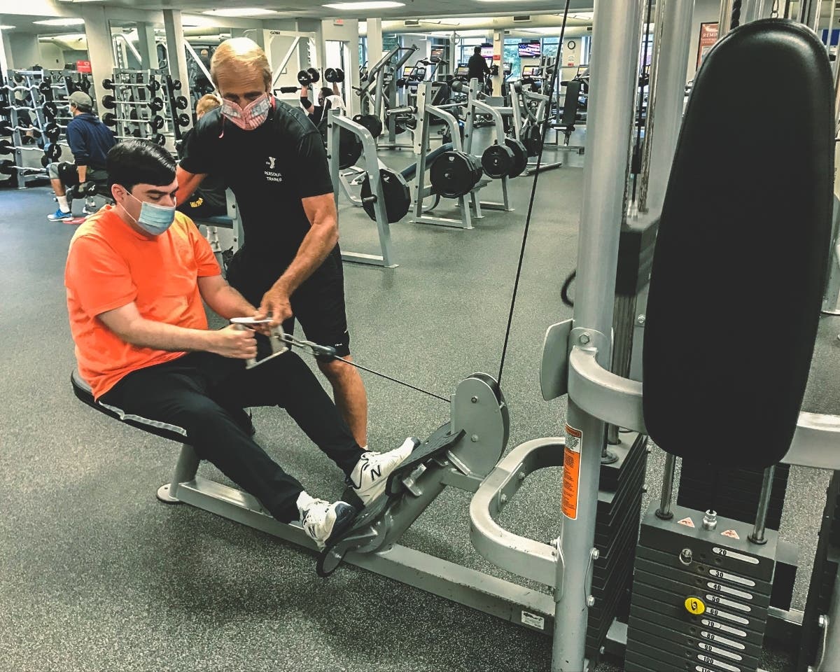 Pictured are Madison Area YMCA member Michael DeRocco from Chatham and Personal Trainer Sam Pagano during an individualized personal training session, a benefit that Madison Area YMCA members are able to access. 