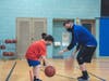 Pictured is Everett Reed, age 8 from Florham Park, learning basketball dribbling skills in a Sports Pod with Interim Sports Coordinator Sean Landolfi.