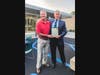 (LtoR) Pictured is Madison Mayor Robert H. Conley presenting a proclamation to retiring Madison Area YMCA Board Chair Scot Guempel, declaring July 21 as Scot Guempel Day in Madison.