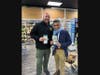 Pictured at Main Street Wine Cellar in Madison: Sergeant Ken Shannon, Main Street Wine Cellar Owner Amrish Vakil.