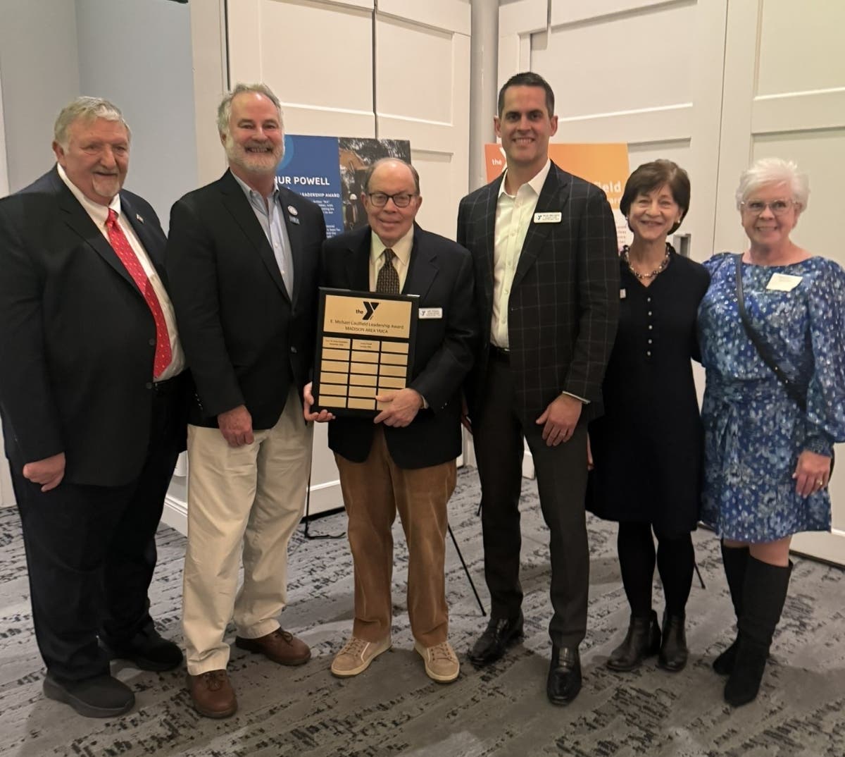 Pictured are former Madison Area YMCA CEO Barry Kroll, Madison Mayor Robert H. Conley, E. Michael Caulfield Leadership Award recipient Art Powell, Board Chair Michael Griffin, President & CEO Diane Mann, and Executive Advisor Sharon Kunas.