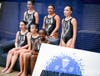 Members of the Madison Area YMCA Rays Artistic Swimming Team who qualified for the 2026 Junior Olympics gather with Head Coach Andrea Diaz-Gonzalez (not pictured) after competing in Ypsilanti, Michigan.