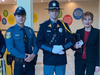 Members of the Voorhees Police Department with Stella Sytnik of Voorhees Township at the Fallen Comrade Ceremony at Voorhees Town Center. 