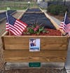 Russell Sayer's friends at the community garden created a memorial in his honor after his passing.