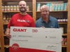 Shawn Calafaty. Store Manager, Giant Supermarket of Warminster presents a $10,000 check to Mike Cerino, Executive Director, Warminster Food Bank. 