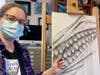Creative Arts instructor Sam Sieber demonstrates how to draw an ear of corn.