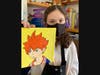 Art student Kendall Rozumny, age 13, displays her finished anime character painting.