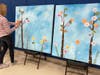 Educator Janine Haugen adds an inspirational quote to the mural
