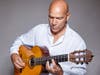Gerard Edery, master singer, guitarist and leading musical folklorist.
