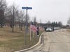 Police vehicles line up outside of the College of Lake County Friday morning.