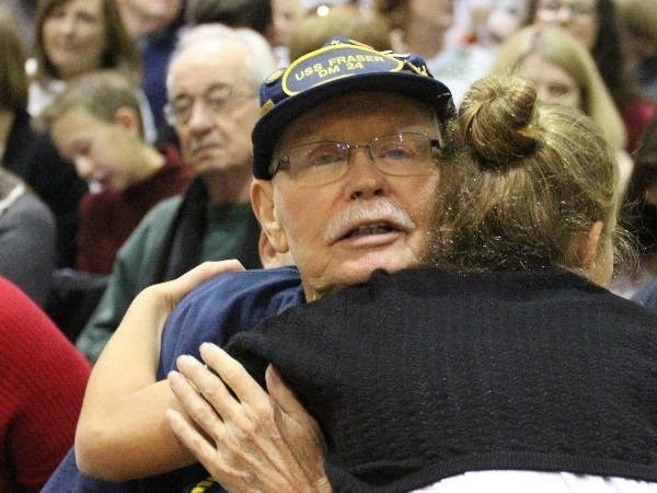 A student at GMS South greets her veteran guest at a previous ceremony.