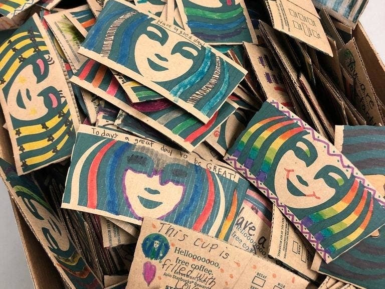 Students at Prairie Grove District 46 decorated coffee sleeves, which include kind messages and will be distributed at a Crystal Lake Starbucks starting this weekend. 