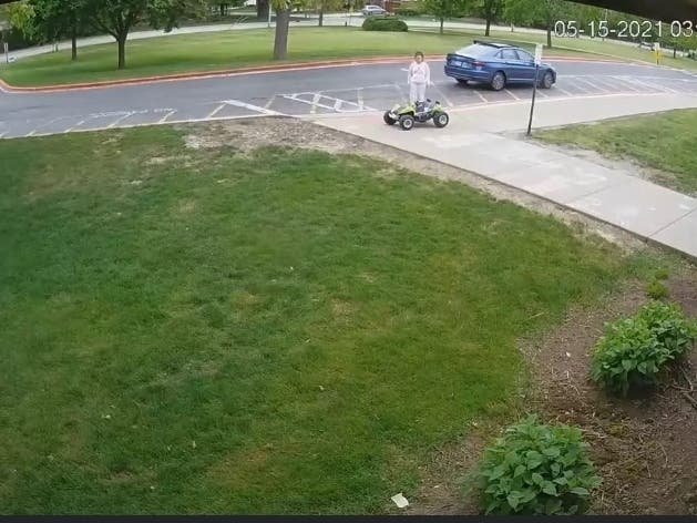 In a surveillance video shared on the police department's Facebook page, the woman can be seen lifting the Power Wheels vehicle and putting it into her trunk. She then drives away.