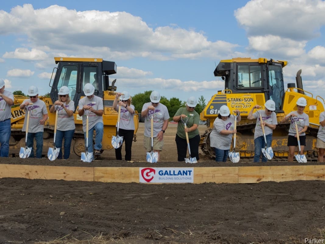 The Food Shed Co-op board of directors break ground at the location of the future grocery store in Woodstock. 