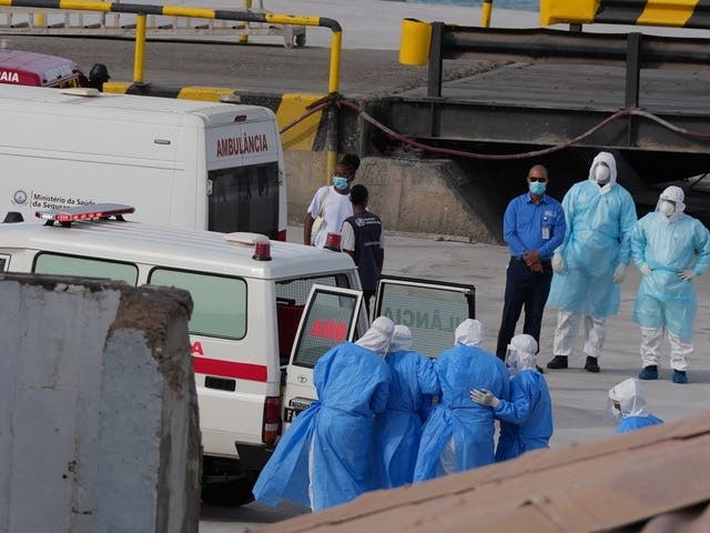 Health workers in protective gear evacuate patients from the MV Hondius cruise ship into an ambulance at a port in Praia, Cape Verde, on Wednesday, May 6, 2026. 