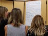 Teachers brainstorm the possible traumas children may face during trauma-informed instruction. 