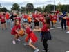 Students practice their passing skills by seeing which line of students is the fastest. 