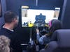 A student drives a construction vehicle on a virtual site. 
