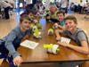 Simmons Elementary School third grade students with their sock rolls. 