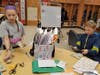 Student Council members count the money raised for the Women’s Animal Center. 