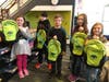 Students in Kati Bryson’s classes, prior to the COVID-19 pandemic, hold backpacks donated by Heritage Conservancy. The backpacks were filled with supplies to explore nature with.