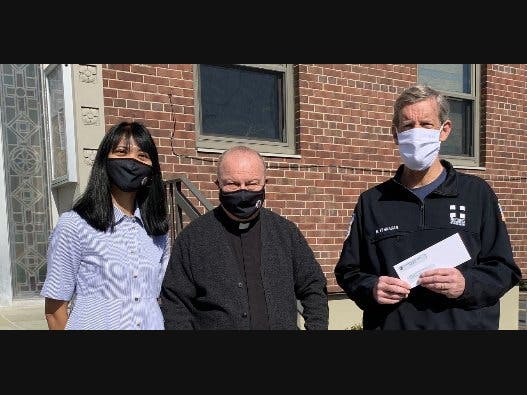 (L-R) Karen Barisonek, Finance Director for St Teresa’s; Father Bob; and Bob Flanagan, President of the Summit First Aid Squad.