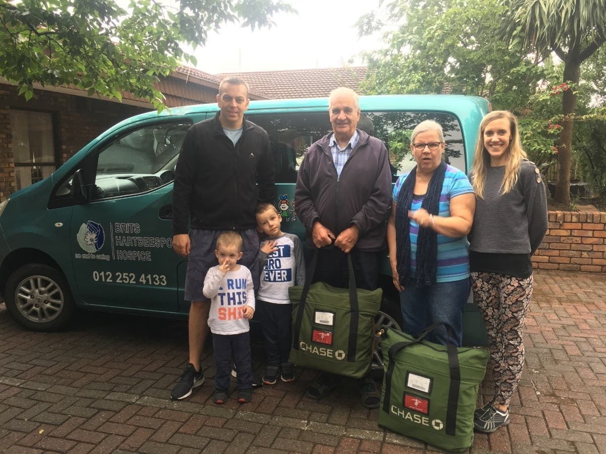 Marylanders Yvotte and Elicia Brits and their two children delivering the Medicine With a Mission donation Brits-Hartbeespoort Hospice representatives.