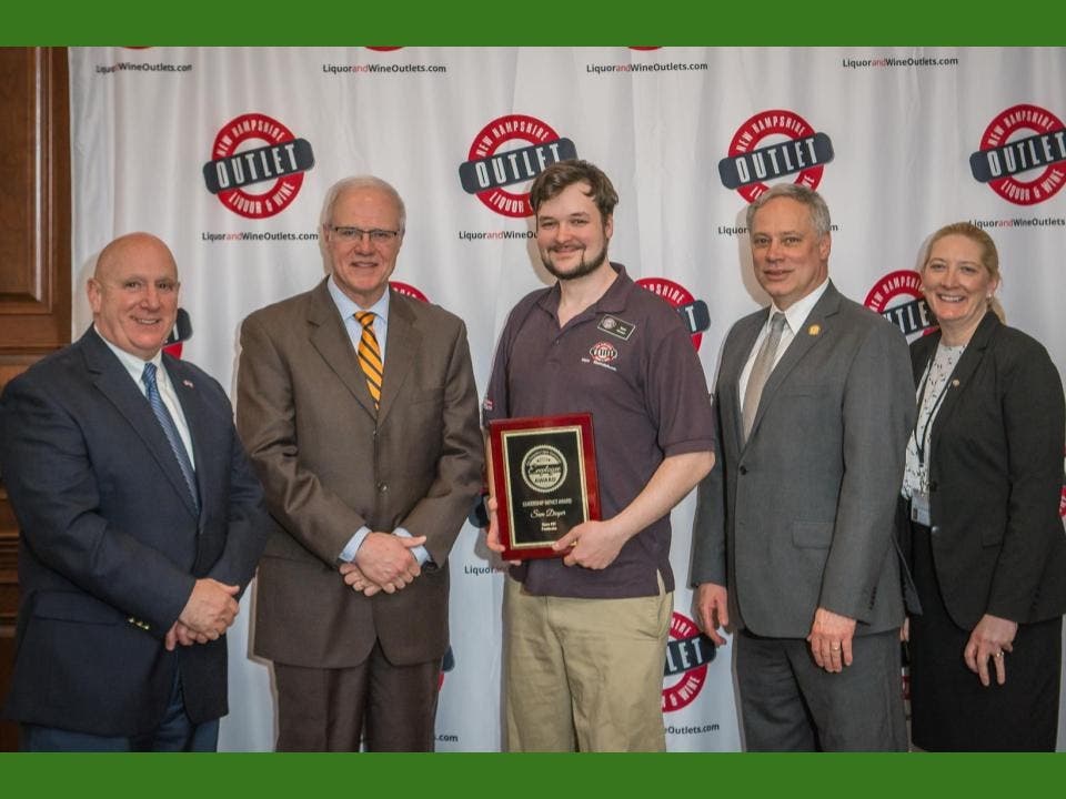 Sam Draper was honored earlier this month for his "leadership impact" at the Pembroke liquor and wine store.