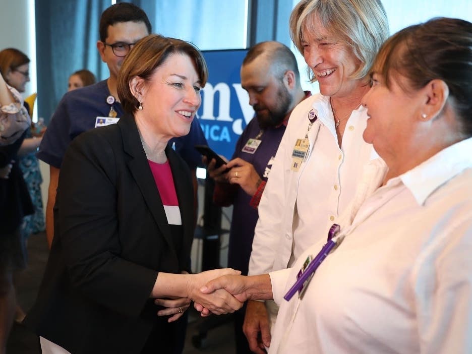 Sen. Amy Klobuchar (D-MN), greets people as she holds a Health Care roundtable in Miami.