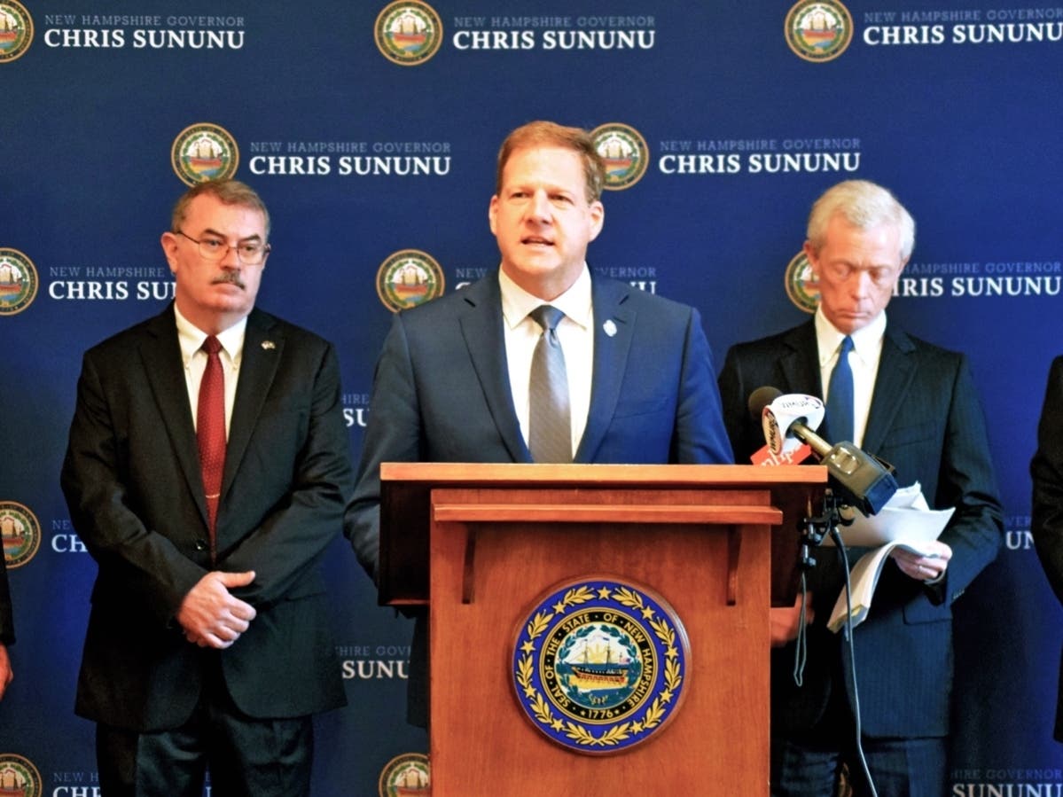 Gov. Chris Sununu speaks with state officials at a press conference concerning PFAS lawsuits. 