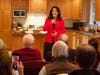 U.S. Rep. Tulsi Gabbard, D-Hawaii, talks with voters at a house party in Bow on Oct. 3. 
