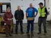 Maria Manus Painchaud and Tim Grotheer of the Capital Region Food Program offered awards to Charlie Bristol, middle right, and Lee Lavoie, far right, on Dec. 17.