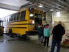 Concord School District students unload food from a bus on Dec. 17. 