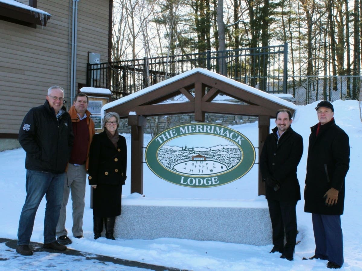 Chris Brown, Tom Cimikoski, Linda Lorden, Matt Walsh, and Tom Aspell pose with the new Merrimack Lodge at White Park sign.