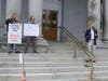Former state Rep. JR Hoell, R-Dunbarton, leads a prayer at the worship service rally at the Statehouse in Concord May 16. 