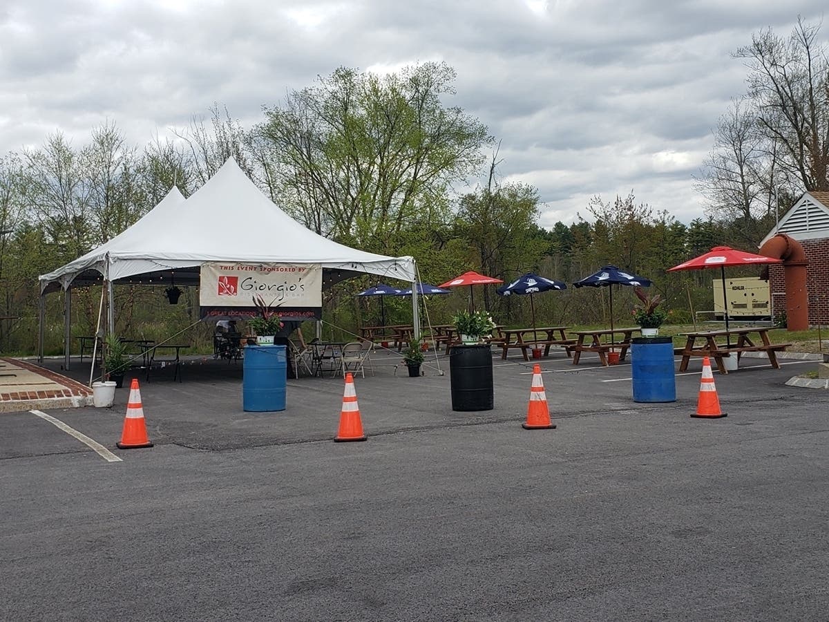 Giorgio's Restaurant in Merrimack prepares to serve customers via outdoor seating May 18, the first day of reopening in New Hampshire after the new coronavirus caused shutdowns around the state. 
