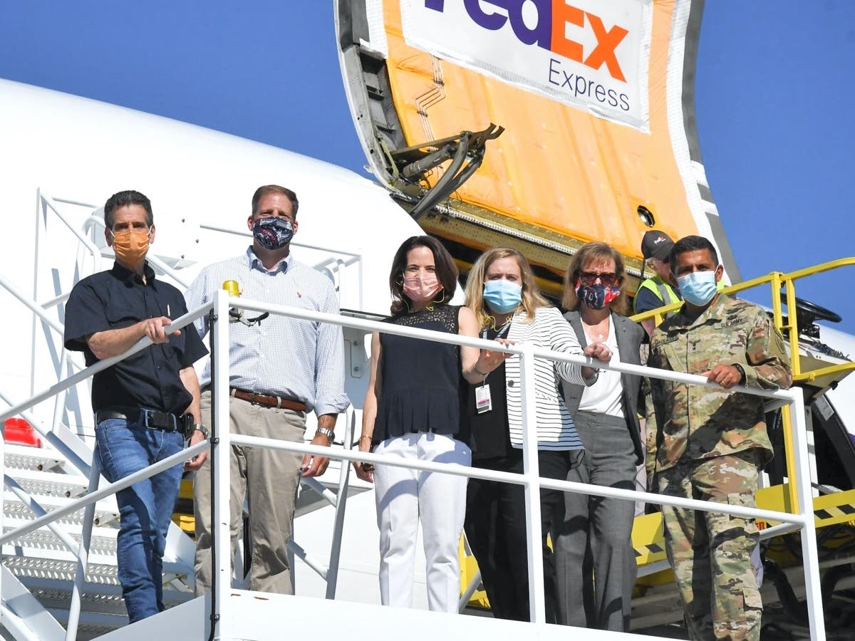 Dean Kamen, left, assisted New Hampshire for the seventh time in securing personal protective equipment July 21 including 400,000 gowns to be shipped to Veterans Affairs hospitals around the U.S. He is pictured here with other officials.