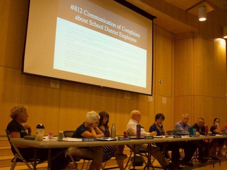 At the height of the Primo "Howie" Leung teacher-student rape case in September 2019, Jennifer Patterson, with the mic, explains board policy regarding the public not speaking specifically about an individual SAU 8 employee at meetings.