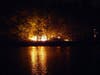 Firefighters battled a fire on an island in the middle of the Merrimack River off Hall Street Sept. 22.