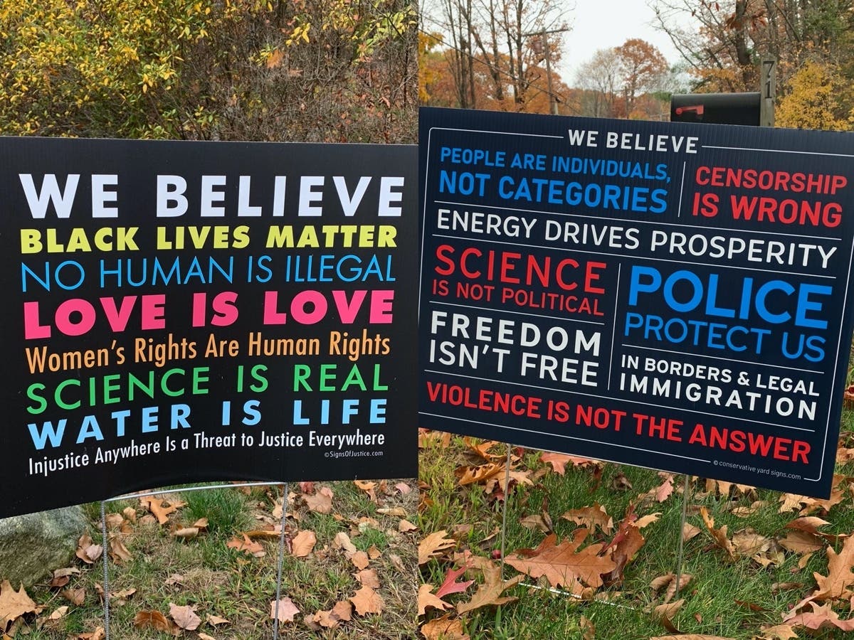 Political signs in Concord showing the clear political divide facing the nation and the state of New Hampshire as voters look at the same issues and see different problems and solutions.