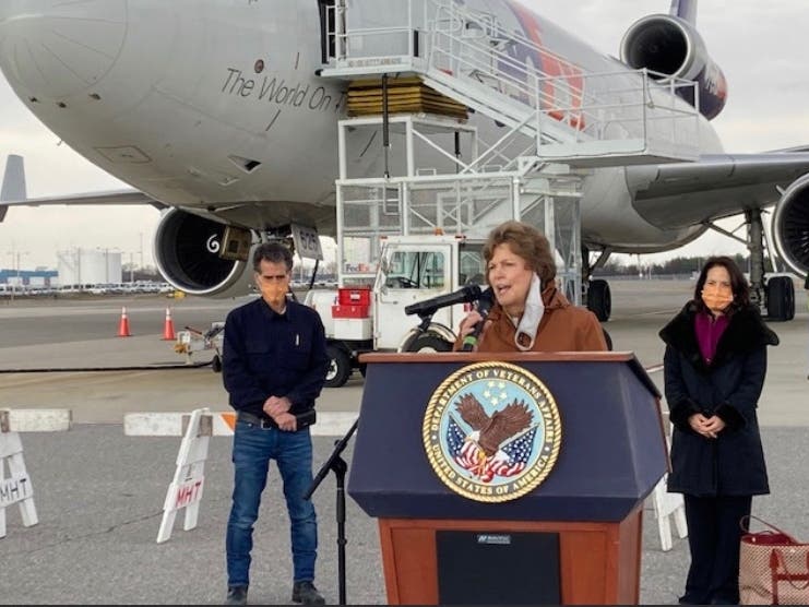 Sen. Jeanne Shaheen speaks after a shipment of PPE, lined up by Dean Kamen, left, arrived in New Hampshire on Nov. 20. 