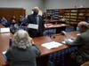Orville "Bud" Fitch, a secretary of state's office attorney, shows Kathy Sullivan, a member of the Ballot Law Commission, a rejected absentee ballot from Windham from the 2020 election in Concord on Nov. 23.