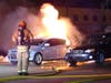 Firefighters extinguish a car fire in Bow on Jan. 18. 