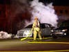 Firefighters extinguish a car fire in Bow on Jan. 18. 