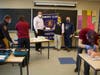 Mark Lester, left, the president of the Kiwanis Club of Concord, hands off a check to Keith Wilding, a department chair at NHTI, for equipment to be used by future EMTs in New Hampshire. Chris Pappas, another Kiwanis member, is standing at the right.