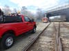 Witnesses reported hearing explosions and black smoke billowing from underneath the Water Street bridge on April 8 after another homeless camp fire in Concord.